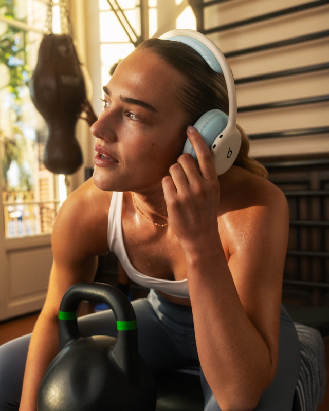 A person working out while wearing Beats 360 headphones.