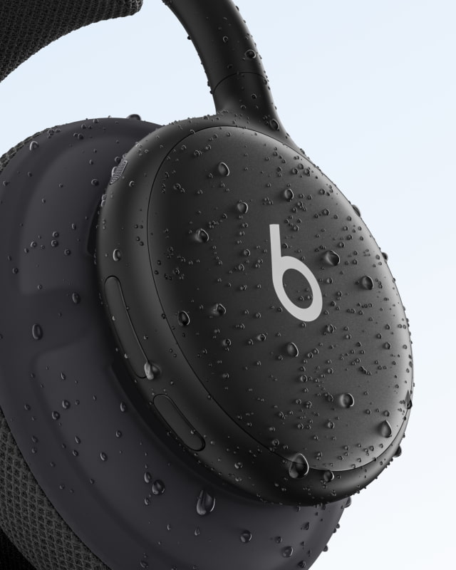 Close-up of black Beats 360 headphones with water droplets on the earcup