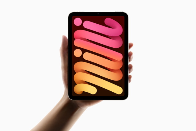 A hand holds the A17 Pro iPad mini.
