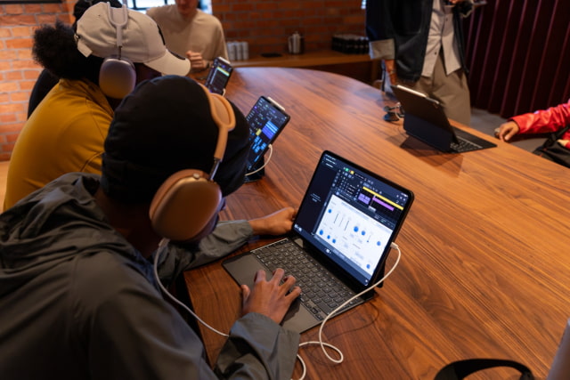 Students work on Apple devices in a classroom setting as part of the Apple x King's Trust Creative Labs.