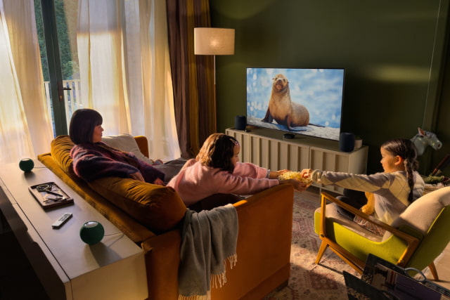 Apple TV 4K with two HomePods in front and two HomePod mini 2 speakers behind.
