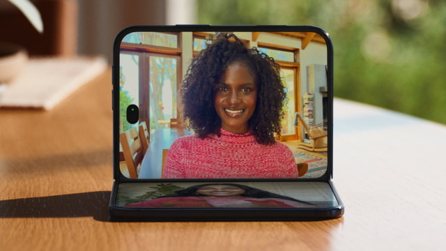 Apple's illustration of a FaceTime call on iPhone Duo propped open on a table.