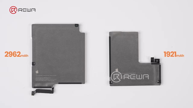 The two removed iPhone Duo batteries, labeled 2,962 mAh and 1,921 mAh.
