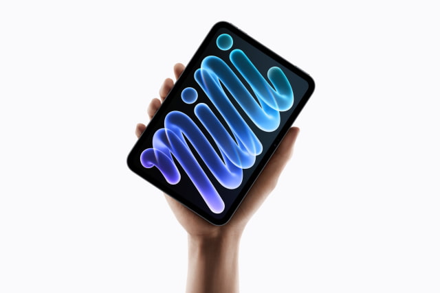 The redesigned iPad mini with OLED display held in one hand.