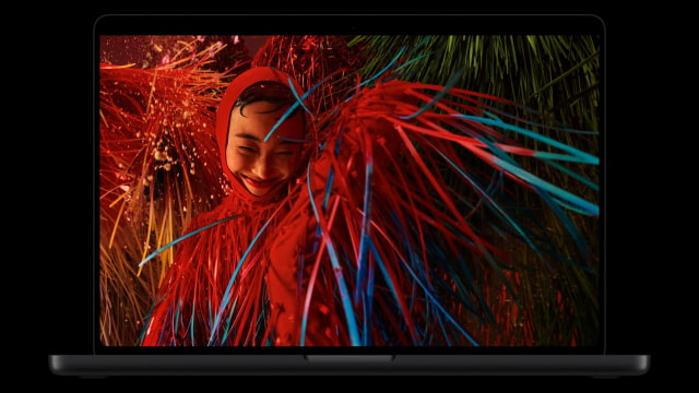 MacBook Pro with PROLED XDR Display showing a colorful photograph.