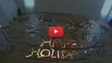 Watch 2,000 iPhone 5s Dominos Say Happy Holidays [Video]