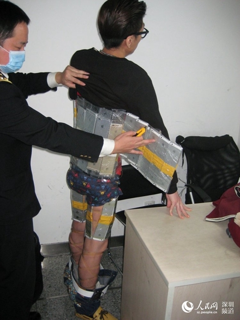 Chinese Smuggler Caught With 94 iPhones Strapped to His Body [Photos]