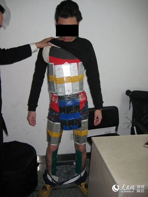 Chinese Smuggler Caught With 94 iPhones Strapped to His Body [Photos]