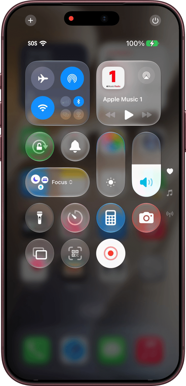 Control Center while recording, the button lit and a red dot in the Dynamic Island.
