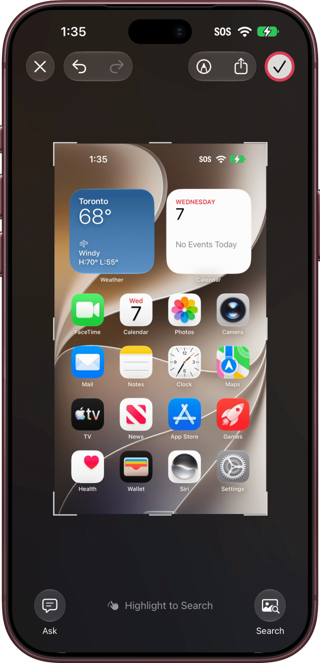 The checkmark outlined at the top right of the screenshot view.