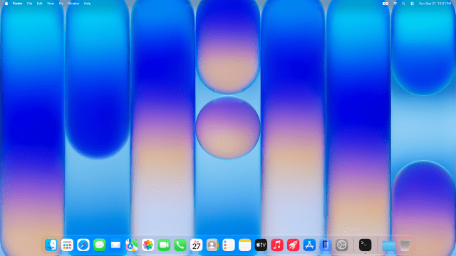The Mac's desktop with Apple's MacBook Neo Indigo wallpaper and the Dock